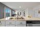 Kitchen island with double sink and stainless steel dishwasher at 808 Brooklet Dr, Davenport, FL 33837