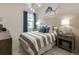 Guest bedroom with striped bedding and nautical decor at 8675 Bridgeport Bay Cir, Mount Dora, FL 32757