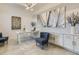 Home office with built-in cabinetry and large artwork at 8675 Bridgeport Bay Cir, Mount Dora, FL 32757