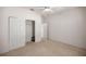 Bedroom with ceiling fan and sliding door closet at 9565 Se 124Th Loop, Summerfield, FL 34491