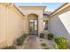 Front entry with arched doorway and landscaped walkway at 9565 Se 124Th Loop, Summerfield, FL 34491