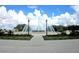 Community entrance with a large fountain and landscaping at 9565 Se 124Th Loop, Summerfield, FL 34491