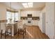 Bright kitchen with stainless steel appliances, granite countertops, a breakfast bar, and ample cabinet space at 9565 Se 124Th Loop, Summerfield, FL 34491