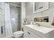 Simple bathroom with shower, toilet and pedestal sink at 9724 Rosemary Ln, Leesburg, FL 34788