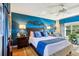 Relaxing bedroom with blue color scheme and comfortable seating at 9724 Rosemary Ln, Leesburg, FL 34788