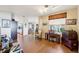 Bright dining area with hardwood floors and view into the kitchen at 9724 Rosemary Ln, Leesburg, FL 34788