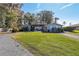 House exterior showcasing a light blue home and landscaping at 9724 Rosemary Ln, Leesburg, FL 34788