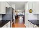 Modern kitchen with stainless steel appliances and white cabinets at 9724 Rosemary Ln, Leesburg, FL 34788