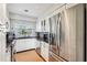 Modern kitchen with stainless steel appliances and white cabinets at 9724 Rosemary Ln, Leesburg, FL 34788