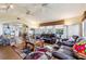 Bright living room with comfy seating and a view into the dining area at 9724 Rosemary Ln, Leesburg, FL 34788