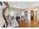 Bright sitting room with hardwood floors and antique furniture at 9724 Rosemary Ln, Leesburg, FL 34788