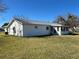 Expansive backyard featuring a well-maintained lawn and exterior view of home at 10173 Se 175Th Ln, Summerfield, FL 34491
