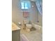 Standard bathroom with single vanity, toilet, tub with shower curtain, and neutral tones at 10173 Se 175Th Ln, Summerfield, FL 34491