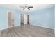 Spacious bedroom with light blue walls and walk-in closet at 105 Juniper Run, Ocala, FL 34480