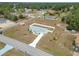 Aerial view of a single-story house with a fenced yard and driveway at 11267 Sw 62Nd Avenue Rd, Ocala, FL 34476