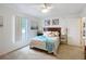 Bedroom with large window, hardwood floors, and ample space at 11267 Sw 62Nd Avenue Rd, Ocala, FL 34476