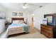 Bright bedroom with double bed, nightstands, and dresser at 11267 Sw 62Nd Avenue Rd, Ocala, FL 34476