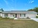 Newly constructed single-story home with a gray exterior and a two-car garage at 11267 Sw 62Nd Avenue Rd, Ocala, FL 34476