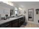 Double vanity bathroom with dark brown cabinets and gray counters at 11414 Roma Rd, Oxford, FL 34484