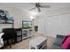 Bright bedroom with TV, desk, and large closet at 11414 Roma Rd, Oxford, FL 34484