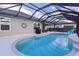 Enjoy this beautiful pool with a screened enclosure and plenty of lounge space at 11414 Roma Rd, Oxford, FL 34484