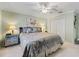 King-size bed in a serene bedroom with soft color tones at 12413 Se 176Th Loop, Summerfield, FL 34491