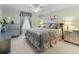 Spacious bedroom with king bed, neutral decor, and natural light at 12413 Se 176Th Loop, Summerfield, FL 34491