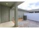 Small paved backyard with a private door and AC unit at 13237 Peaceful Melody Dr, Winter Garden, FL 34787