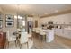 Modern kitchen with white cabinets, quartz countertops, and island seating at 13241 Peaceful Melody Dr, Winter Garden, FL 34787