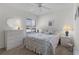 Bedroom with a queen-size bed and dresser at 1341 Lajolla Cir, The Villages, FL 32159