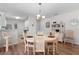 Dining room features a round table with chairs and kitchen views at 1341 Lajolla Cir, The Villages, FL 32159