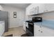 Stainless steel appliances and light blue countertops in this galley kitchen at 1341 Lajolla Cir, The Villages, FL 32159