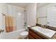 Bathroom with a shower-tub combination and a vanity with a faux marble countertop at 15065 Se 93Rd Ave, Summerfield, FL 34491