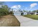 Charming one-story home with a well-manicured lawn, two car garage, and light blue painted siding at 15065 Se 93Rd Ave, Summerfield, FL 34491