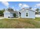 Charming one-story home with a well-manicured lawn, two car garage, and light blue painted siding at 15065 Se 93Rd Ave, Summerfield, FL 34491