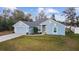 Charming one-story home with a well-manicured lawn, two car garage, and light blue painted siding at 15065 Se 93Rd Ave, Summerfield, FL 34491