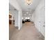 A spacious foyer leads into a bright, open-concept living area with modern furnishings at 15065 Se 93Rd Ave, Summerfield, FL 34491