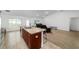 Spacious kitchen island with bar stools and stainless steel faucet at 15065 Se 93Rd Ave, Summerfield, FL 34491