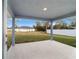 Covered patio that's perfect for outdoor relaxation with a view of the backyard at 15065 Se 93Rd Ave, Summerfield, FL 34491