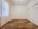 Bedroom with wood-look floors and double closets at 163 Crepe Myrtle Dr, Groveland, FL 34736