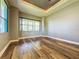 Spacious bedroom with wood-look floors and large window at 163 Crepe Myrtle Dr, Groveland, FL 34736