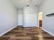 Bright bedroom with wood-look floors and double closets at 163 Crepe Myrtle Dr, Groveland, FL 34736