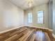 Living room with wood-look floors and neutral-colored walls at 163 Crepe Myrtle Dr, Groveland, FL 34736