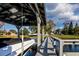 Covered boat slip with dock and walkway at 1735 Lakeshore Dr, Mount Dora, FL 32757