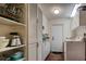 Laundry room with white cabinets, shelves, and a washer and dryer at 1735 Lakeshore Dr, Mount Dora, FL 32757