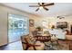 Living Room with French doors leading to a pool and a view of a screened-in patio at 1735 Lakeshore Dr, Mount Dora, FL 32757