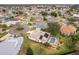 Aerial view of house and community, showing neighborhood and pool at 1870 Saybrook Way, The Villages, FL 32162