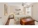 Bedroom with floral bedding and wooden storage chest at 1870 Saybrook Way, The Villages, FL 32162