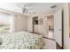 Main bedroom with ceiling fan and en-suite access at 1870 Saybrook Way, The Villages, FL 32162