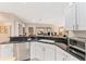 Modern kitchen with dark countertops and stainless steel dishwasher at 1870 Saybrook Way, The Villages, FL 32162